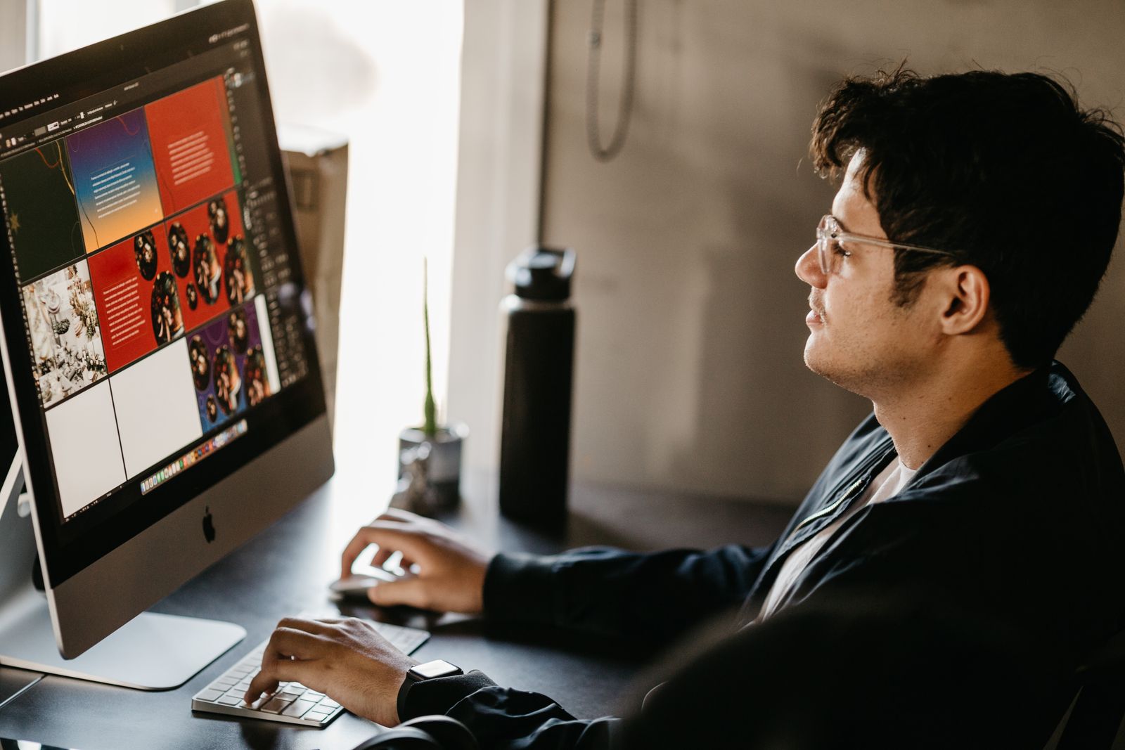 Designer works at a computer in a creative office
