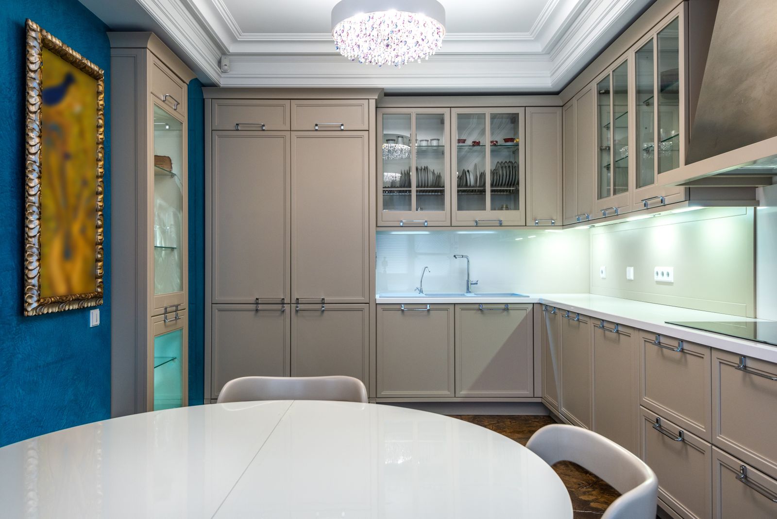 Kitchen interior with cabinets, countertop and dining furniture
