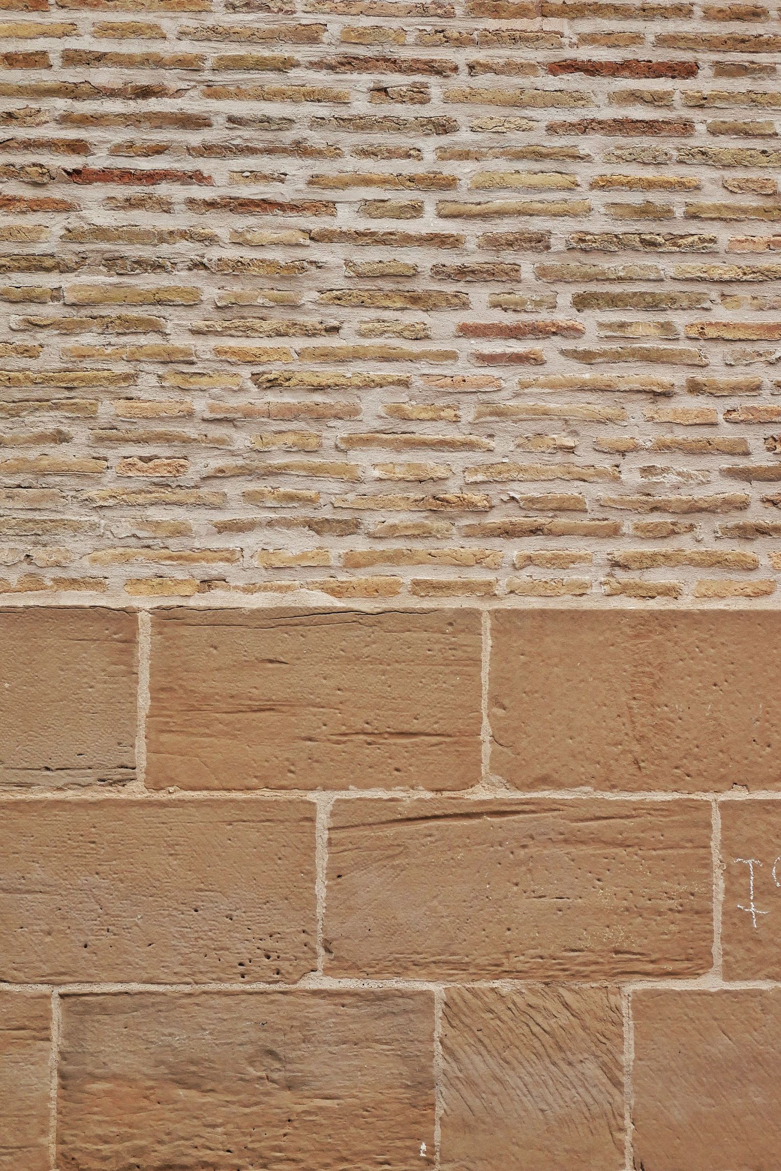 Close detail of rough brick surfaces and recessed mortar